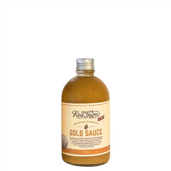 A bottle of Red gum BBQ's gold sauce