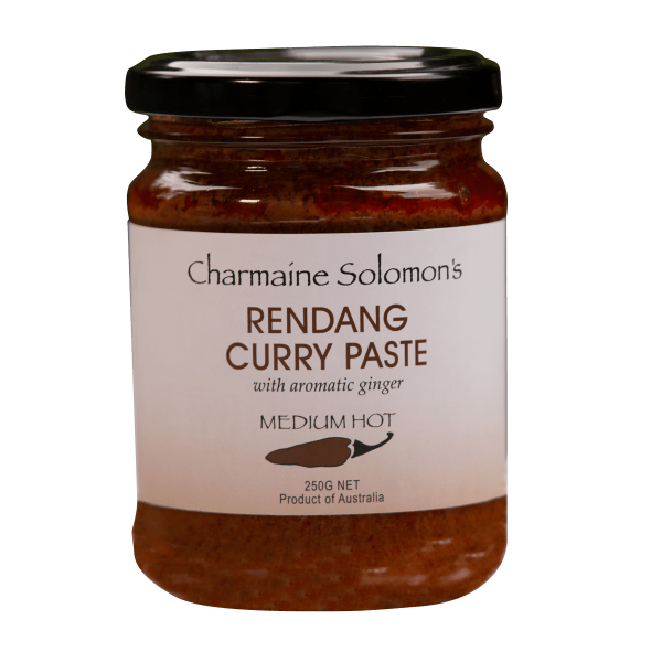 Jar of Charmaine Solomon's Rendang Curry Paste with a black lid on a white background