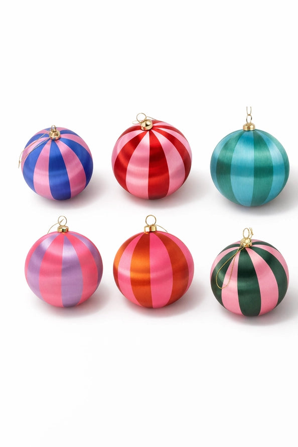 Six striped Christmas ornaments in various colors, including pink, red, blue, green, and orange, arranged on a white background.