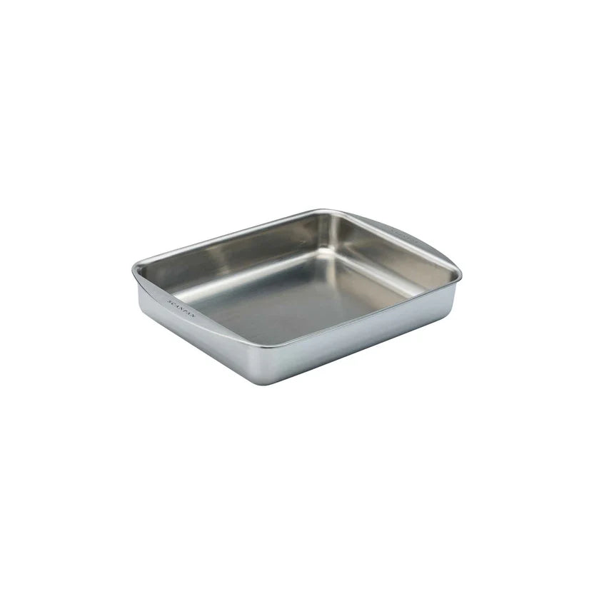 Stainless steel baking tray on a light gray background