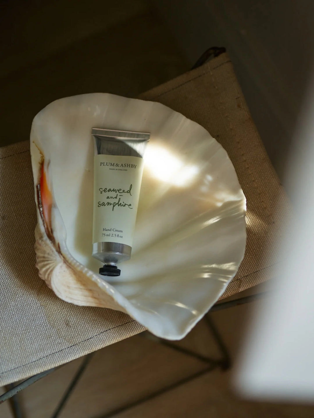 Hand cream in a shell with &