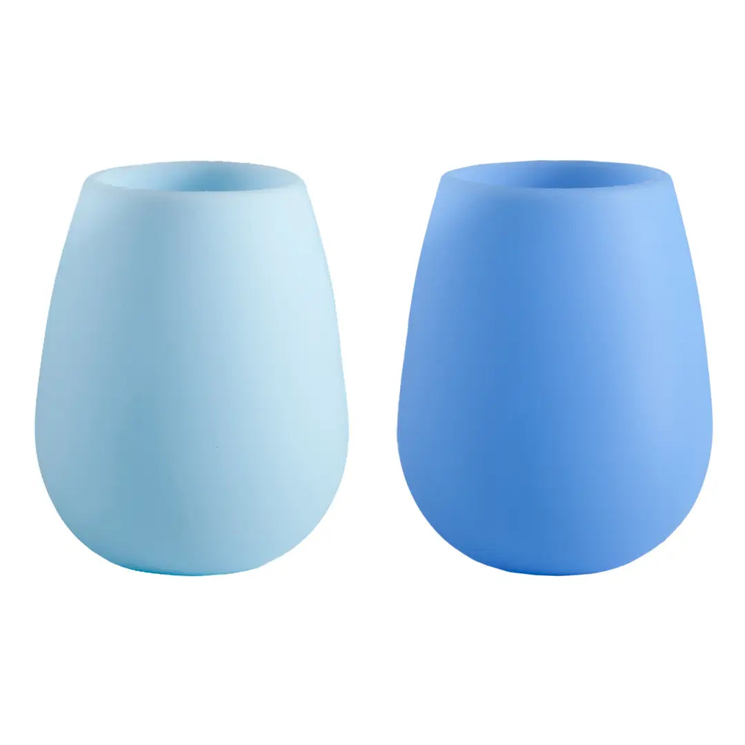 Two blue silicone tumblers on a white background