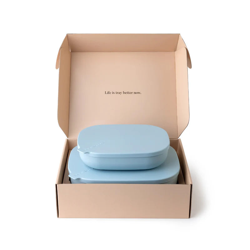 A set of light blue oval-shaped containers with matching lids, neatly stacked inside an open kraft paper box on a white background.