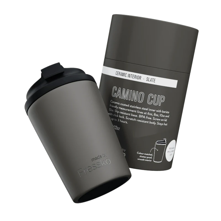 Grey thermos cup with packaging on a white background