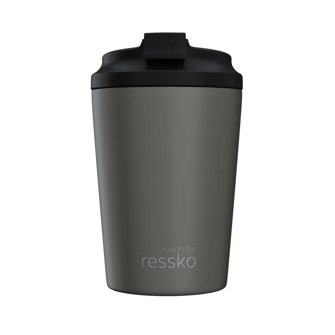Gray tumbler with black lid on a white background