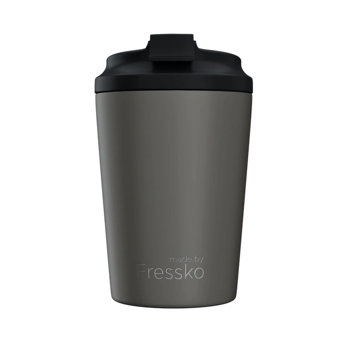 Gray tumbler with black lid on a white background