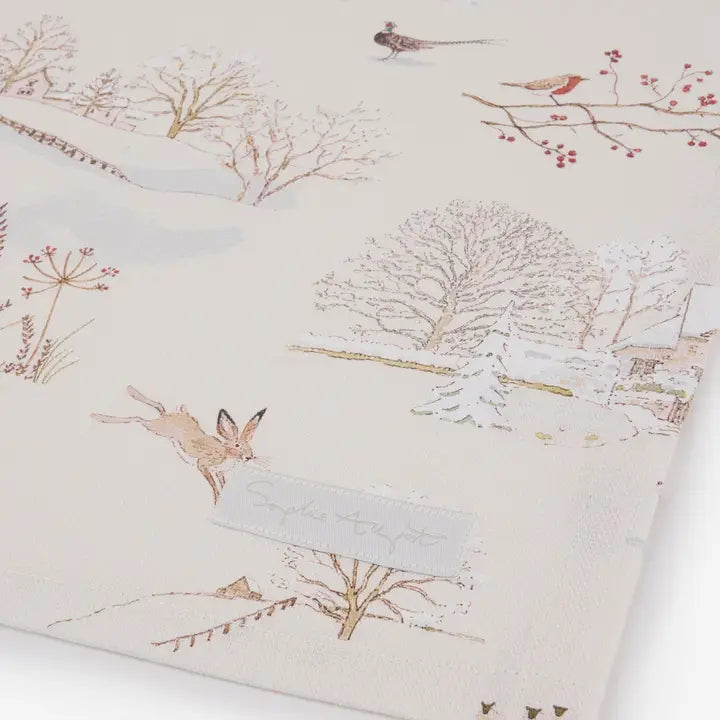 Winter Christmas print on a cream background tea towel