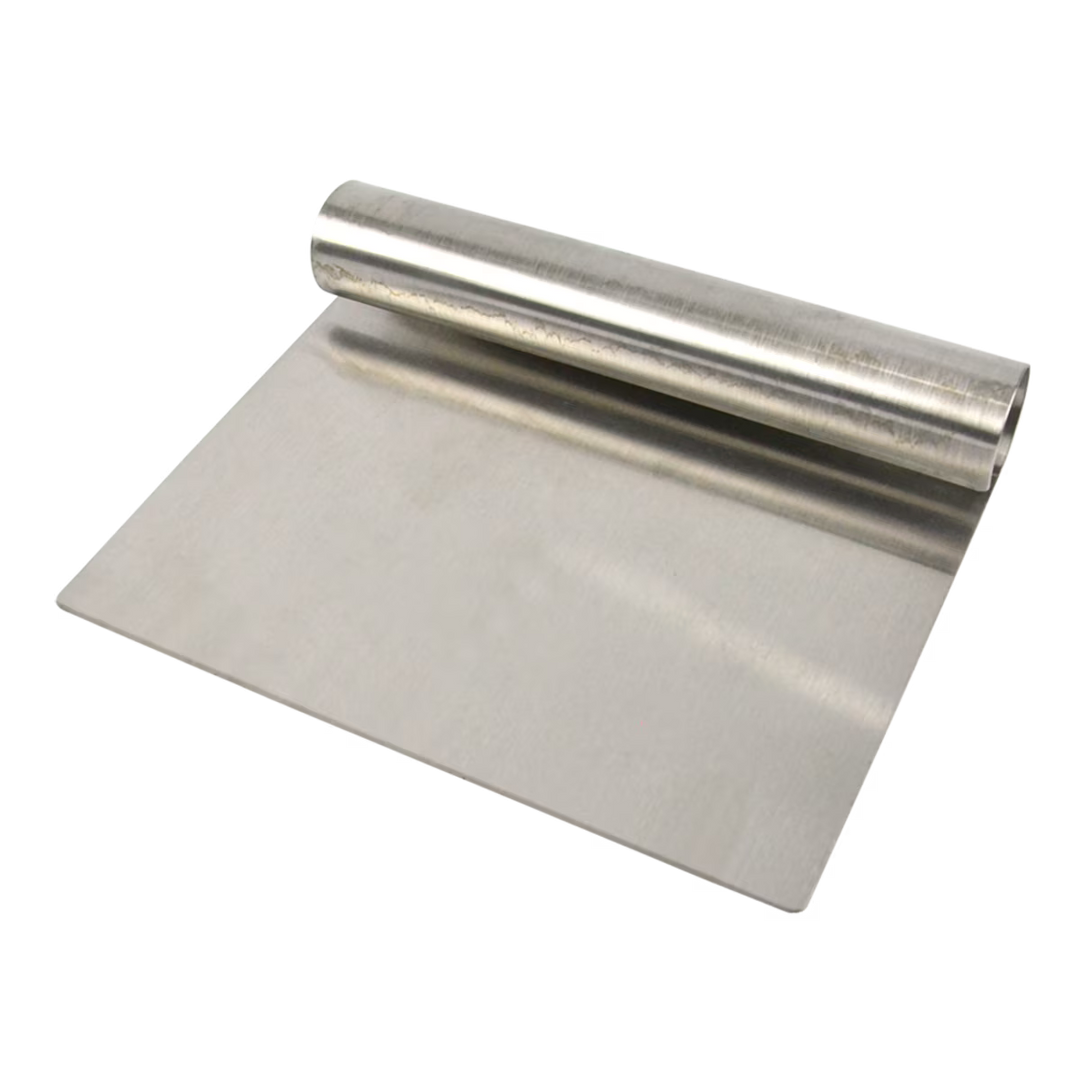 Stainless steel dough scraper on a white background