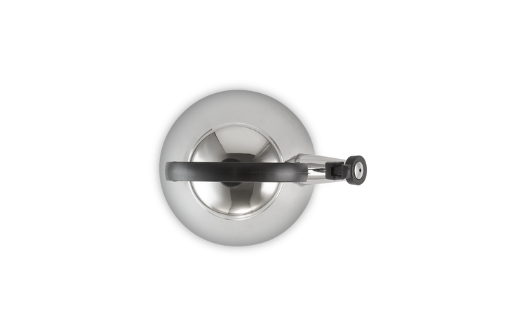 Top view of a Stainless steel teapot with a handle on a white background