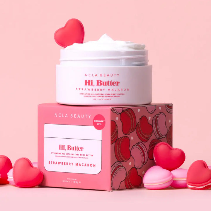 NCLA Beauty HI. Butter Strawberry Macaron product with packaging on a pink background