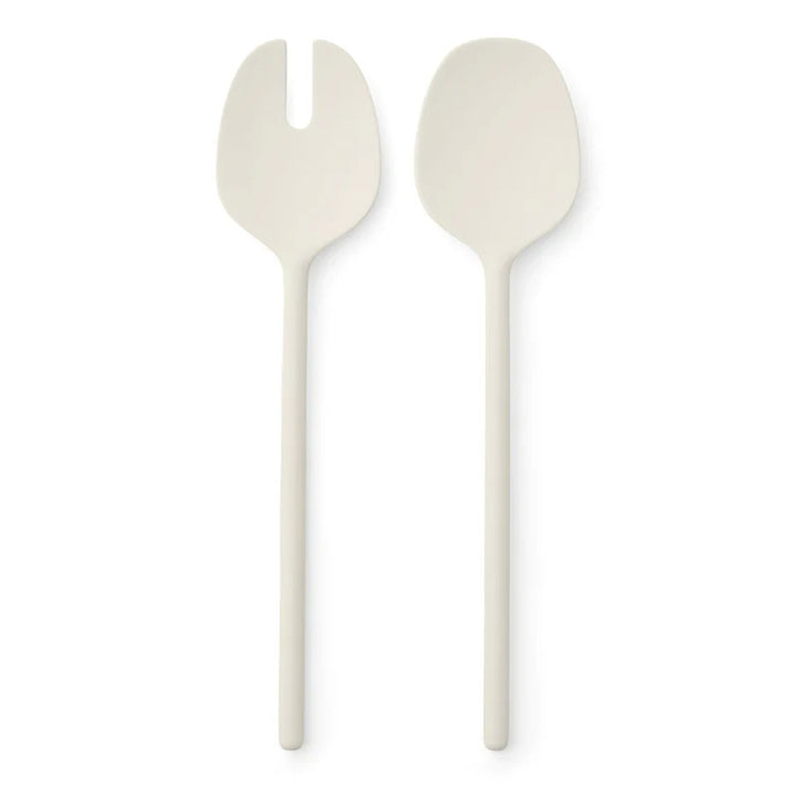 Two matte off-white plastic salad servers, one with a fork head and one with a spoon head, shown vertically on a white background.