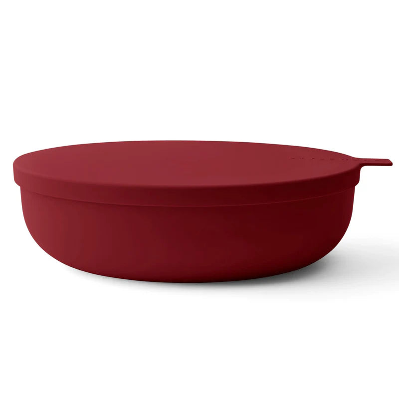 A dark red serving bowl with a matching lid and a small side handle, shown on a clean white background.
