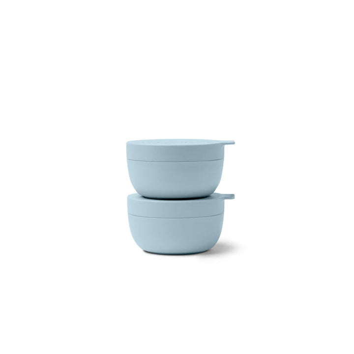 Two light blue containers stacked on top of each other with matching lids, shown on a clean white background.