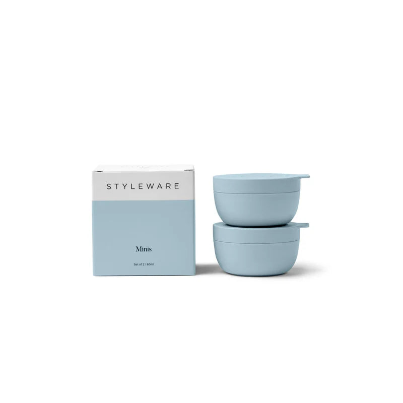 Two light blue containers with a packaging box labeled &