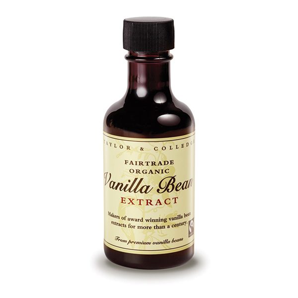 Bottle of vanilla bean extract with a black cap on a white background