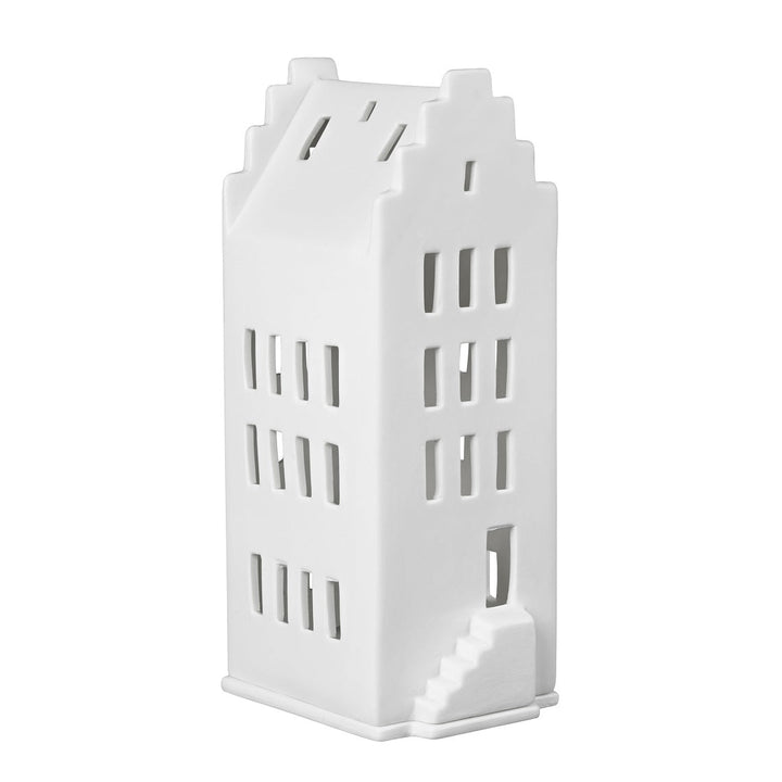 White ceramic tealight house candle holder on a white background