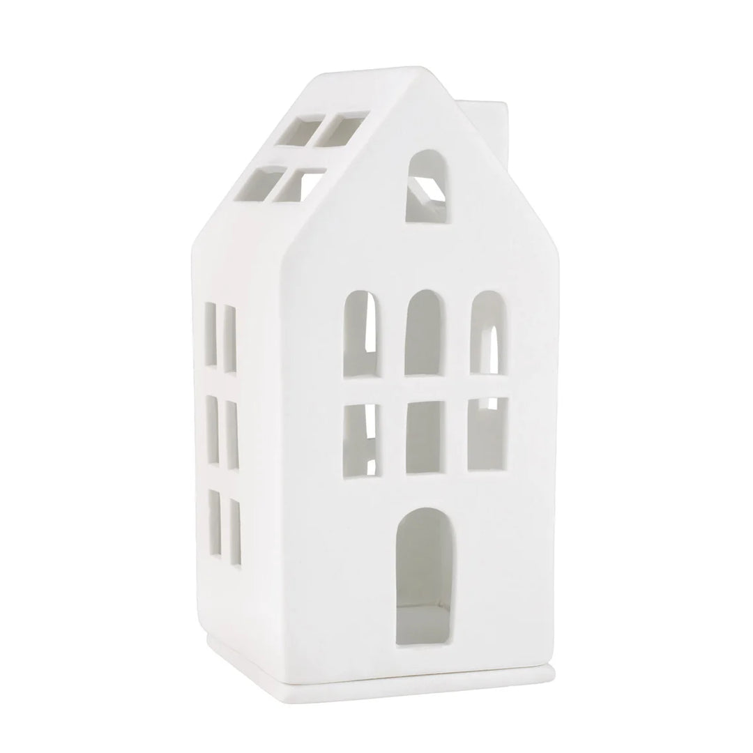 White porcelain tealight house candle holder with arch windows on a white background