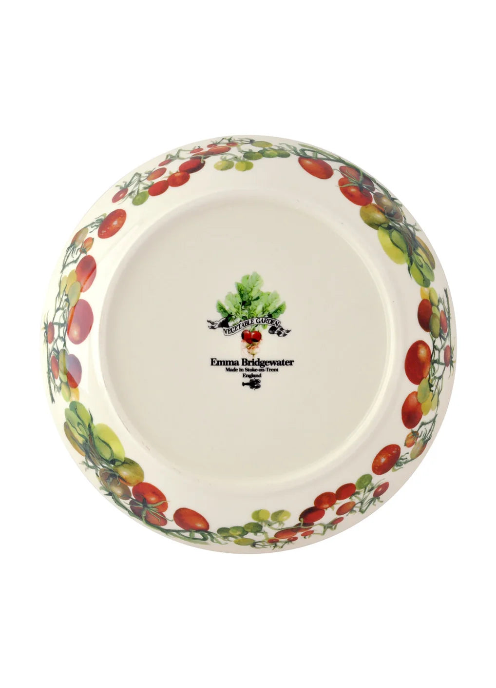A round ceramic plate from Emma Bridgewater, shown from a top-down view. The plate features a white base decorated with a border of red and green tomatoes on the rim, and the brand&
