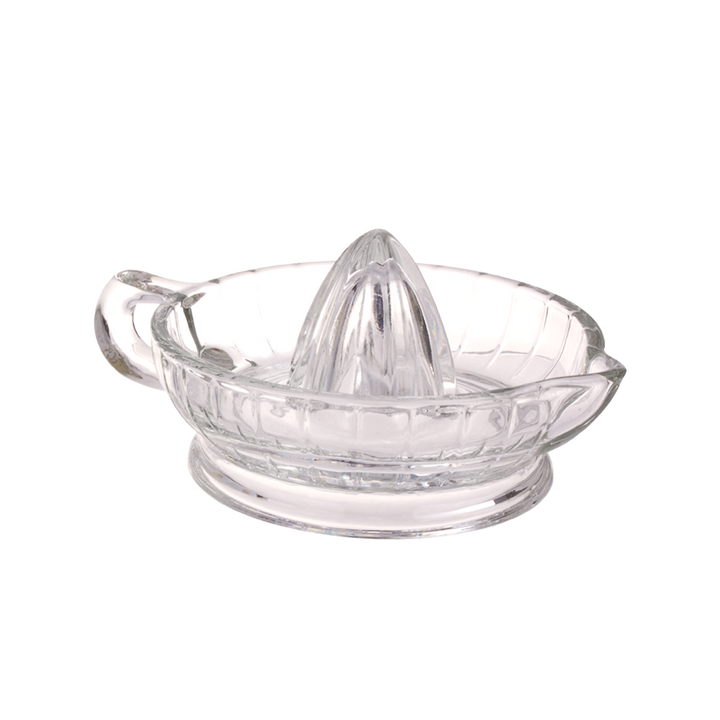 Clear glass citrus juicer on a white background