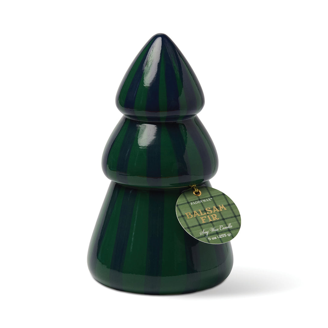 Green ceramic Christmas tree-shaped candle with a label on a white background