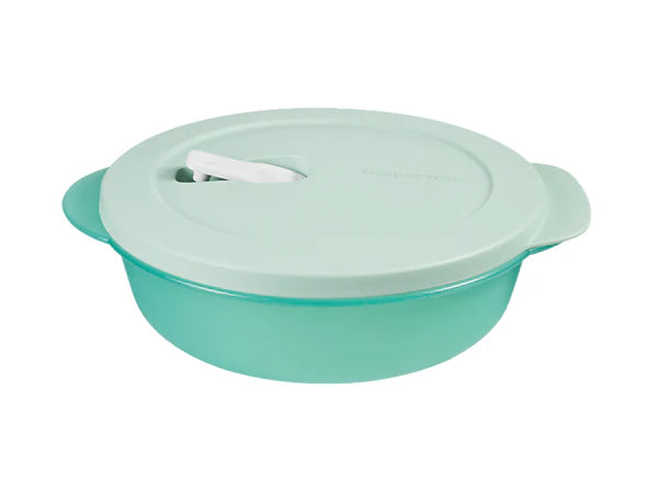 A mint green round plastic microwaveable dish with a matching lid, side handles, and a white release lever on top, isolated on a white background.