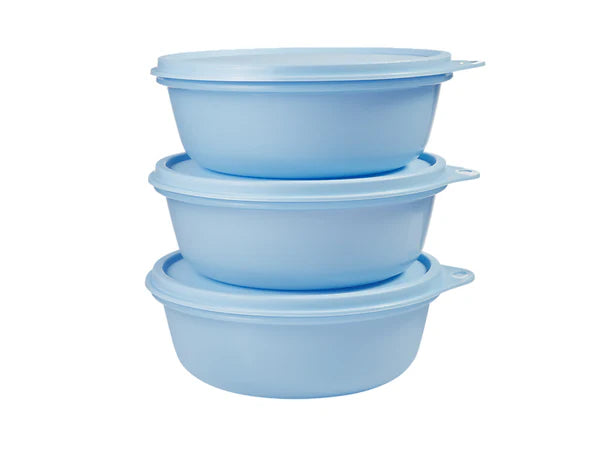 Set of four blue plastic bowls stacked on a white background