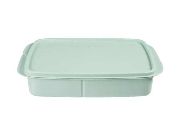 Light green food container with a lid on a white background