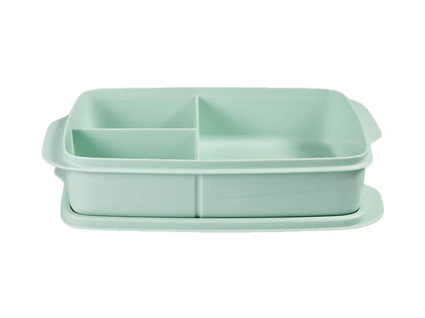 Light green lunchbox with compartments on a white background
