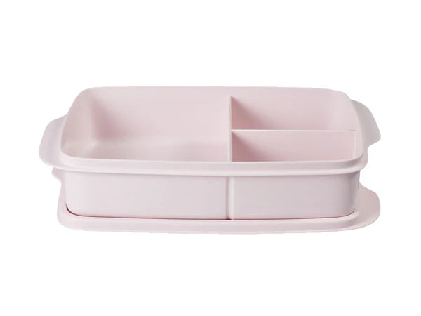 Pink plastic container with compartments on a white background