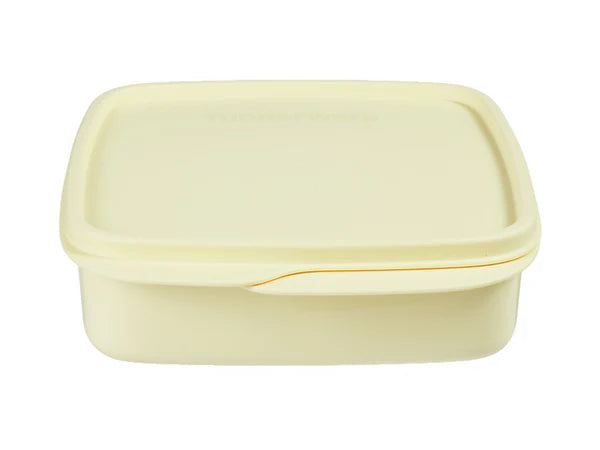 Yellow plastic container with a lid on a white background