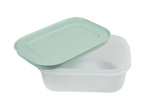 A translucent white plastic rectangular food storage container with a light mint green lid, shown on a plain white background.