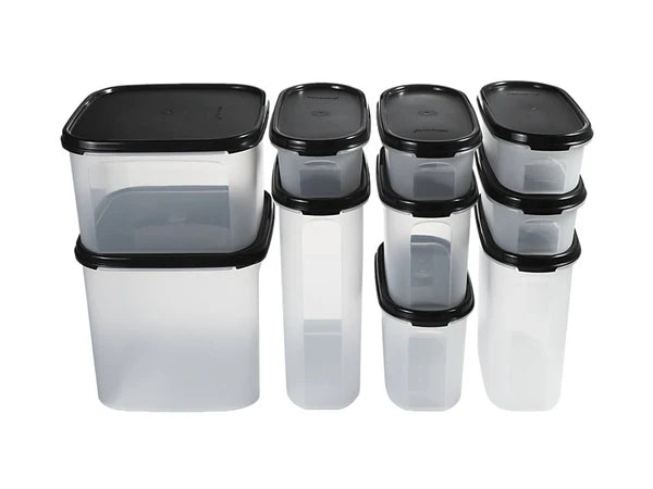 Set of clear plastic containers with black lids on a white background