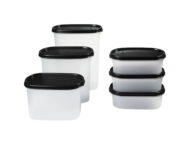 Set of white food storage containers with black lids on a white background