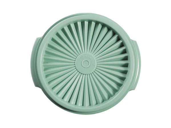 Mint green kitchen tool with a textured design on a white background