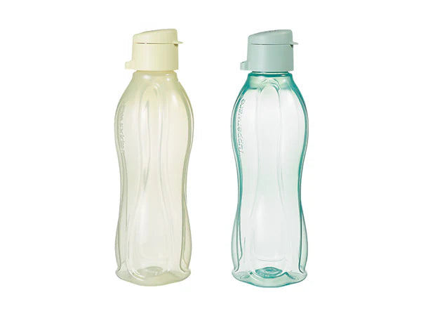 Two reusable plastic water bottles with ribbed curved bodies and flip-top lids, shown side by side on a white background. One bottle is translucent pale yellow with a cream lid, and the other is translucent light aqua with a pale blue-green lid.