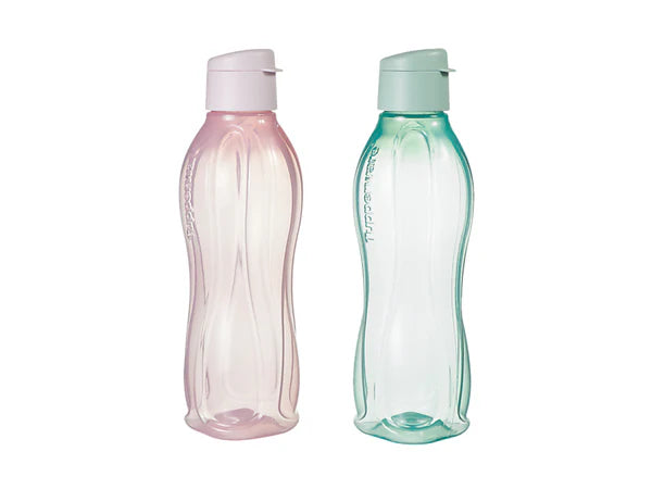 Two plastic water bottles, one pink and one green, on a white background