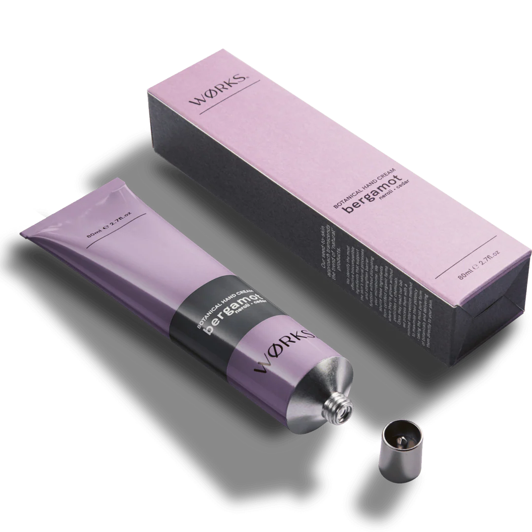 Purple hand cream tube and packaging with 'WORKS' branding on a white background