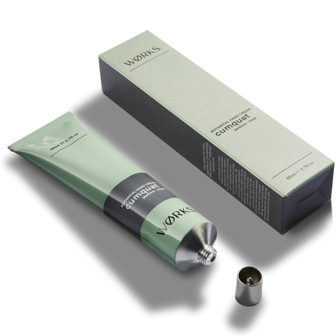 Green tube and packaging with 'works' branding on a white background