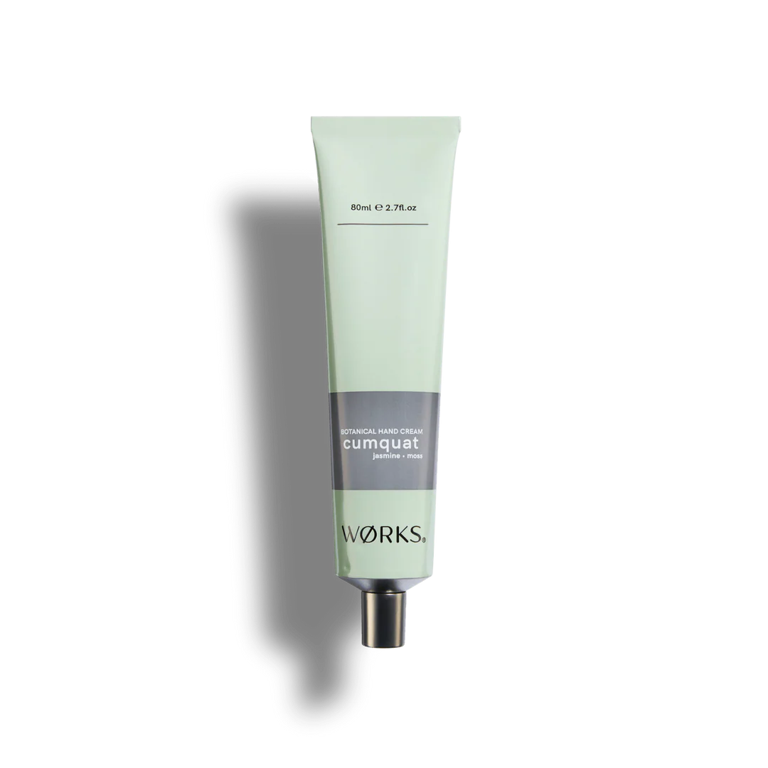 Green tube of hand cream labeled 'cumquat' with 'works' branding on a white background
