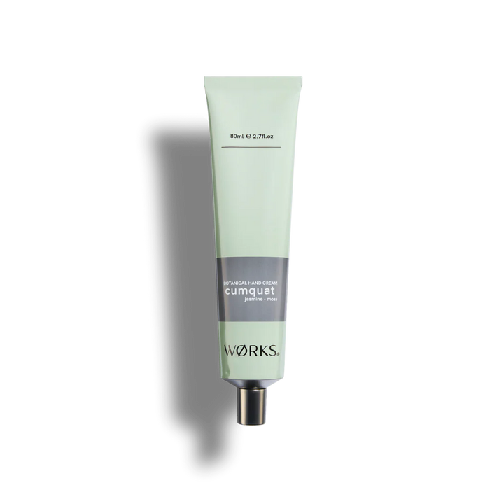 Green tube of hand cream labeled &