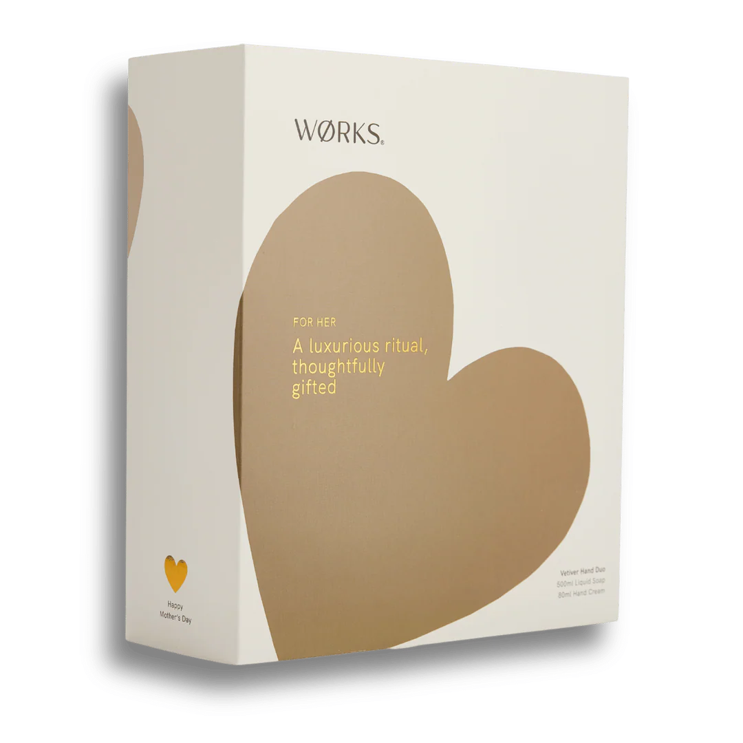 A gift box of hand cream and hand wash with a brown heart on the box on a white background