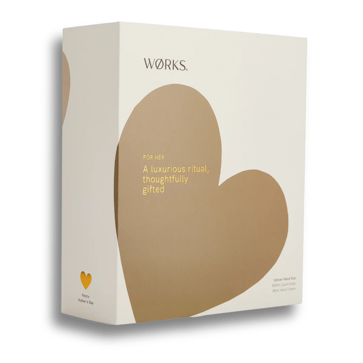 A gift box of hand cream and hand wash with a brown heart on the box on a white background